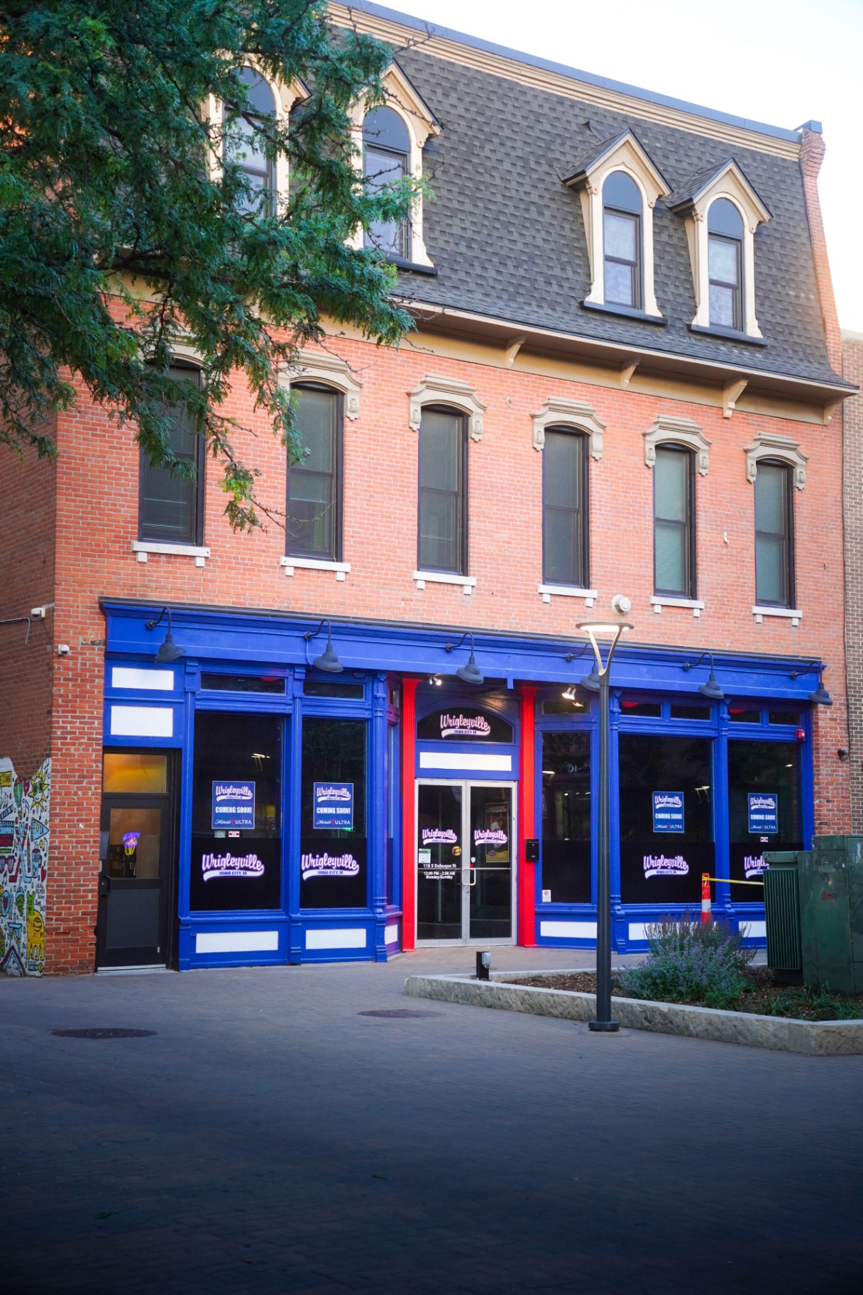 Wrigleyville Iowa City storefront on S Dubuque St at dusk