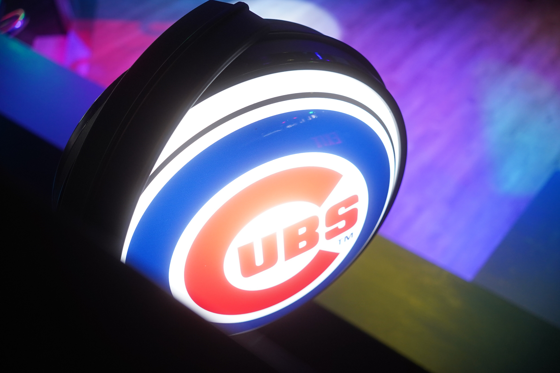 Illuminated Chicago Cubs neon sign at the bar